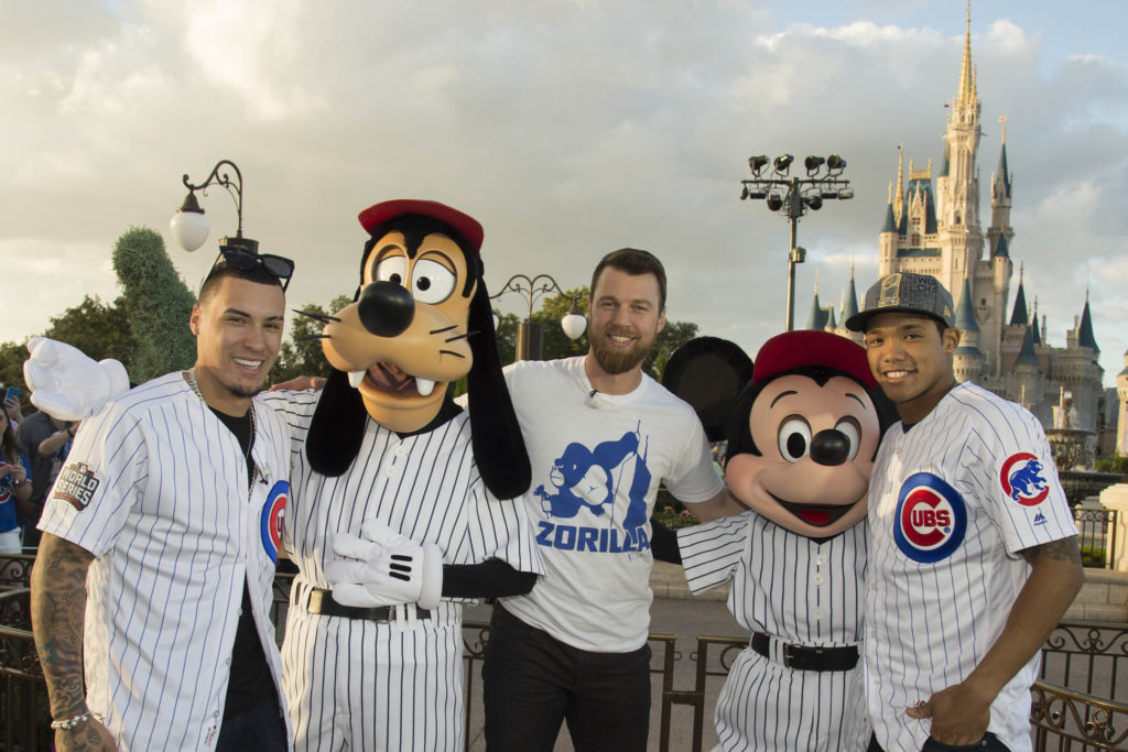 World champions (L-R) Javier Baez, MVP Ben Zobrist and Addison Russell, of the Chicago Cubs, pose for a celebratory photo with Goofy and Mickey Mouse Saturday, Nov. 5, 2016, at Magic Kingdom Park in Lake Buena Vista, Fla. The players were honored among thousands of fans in a parade at Walt Disney World celebrating the team's historic victory. (Preston Mack, photographer)