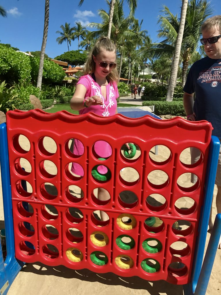 Playing Connect Four on the beach at Disney's Aulani